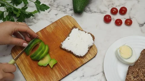 Healthy avocado toasts with rye bread, sliced avocado, eggs, cottage Stock Footage 272158012
