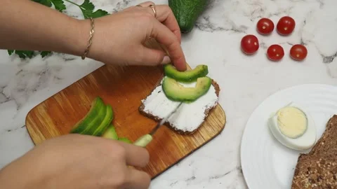 Healthy avocado toasts with rye bread, sliced avocado, eggs, cottage Stock Footage 272158024