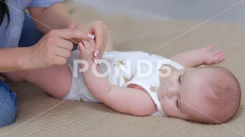 Healthy baby development mom exercises newborn Stock Photos