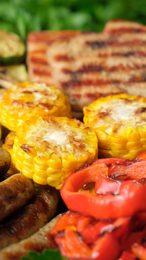 Healthy BBQ platter with vegetable, sausages and meat Stock Footage 337934257