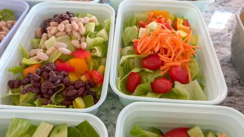 Healthy bean salads in rectangular containers Stock Photos