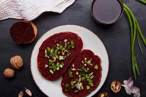 Healthy beetroot spread sandwiches with spring young onion, garlic and walnuts Stock Photos
