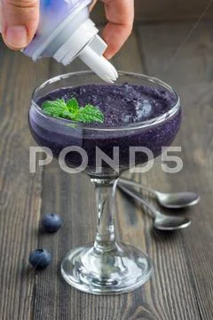 Healthy boiled egg blueberry mousse with whipping cream in glass Stock Photos