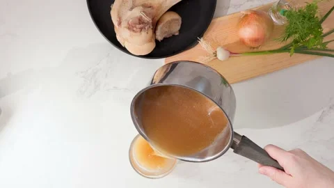 Healthy Bone Broth Beverage in Glass: Nutritious, Ready-to-Drink Wellness Stock Footage 344032113