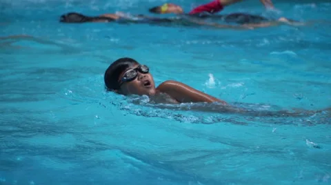 Healthy boy front crawl swims slow motion in swimming pool Stock Footage 68024249