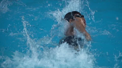 Healthy boy front crawl swims slow motion in swimming pool Stock Footage 68030004