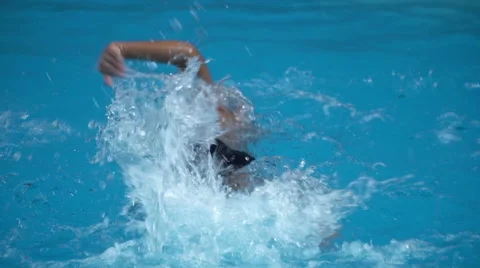 Healthy boy front crawl swims slow motion in swimming pool Stock Footage 68030810