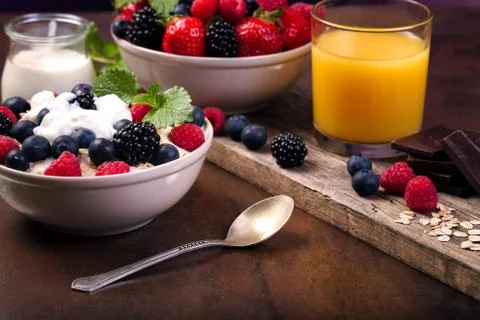 Healthy breakfast and berries with yoghurt. Stock Photos
