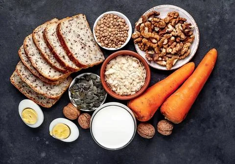 Healthy breakfast with bread eggs vegetables and nuts Stock Photos