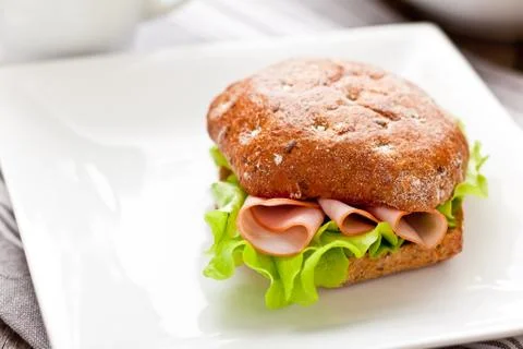 Healthy breakfast with bread roll on the table Фото