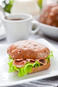 Healthy breakfast with bread roll on the table Photos