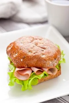 Healthy breakfast with bread roll on the table Stock-Fotos