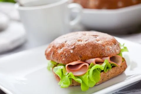 Healthy breakfast with bread roll on the table Stock-Fotos