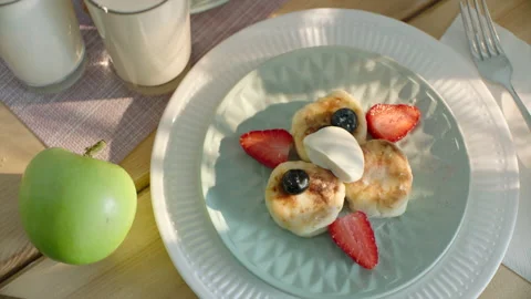 Healthy breakfast with cheesecakes served with berries and fruits Stock Footage 166145663