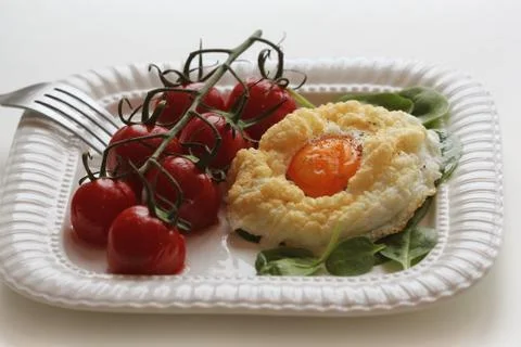 Healthy breakfast with cloud egg ,spinash and cherry tomatoe . Clouds is an o Stock Photos
