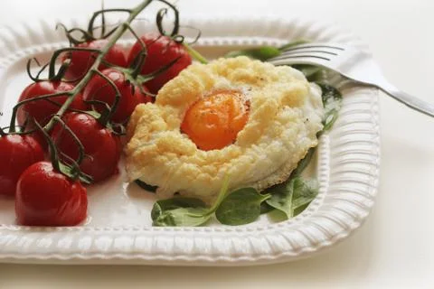 Healthy breakfast with cloud egg ,spinash and cherry tomatoe . Clouds is an o Stock Photos