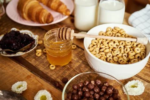 Healthy breakfast with different types of breakfast cereal with honey marmala Stock Photos
