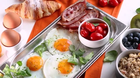 Healthy breakfast with fried eggs Stock Footage 168608126