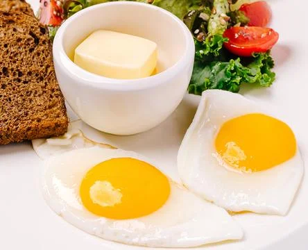 Healthy breakfast plate serving fried eggs rye bread Stock Photos
