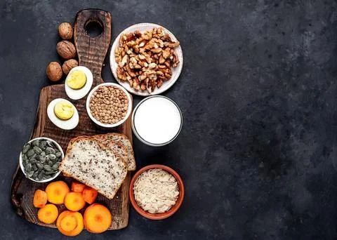 Healthy breakfast spread with bread eggs fruit and milk Stock Photos
