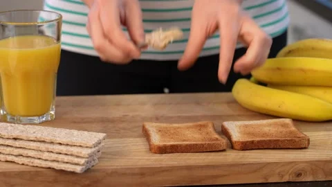Healthy breakfast is toast with peanut paste Stock Footage 155571573
