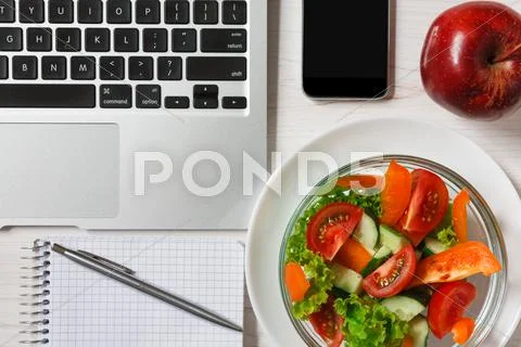Healthy business lunch snack in office, vegetable salad top view Stock Photos