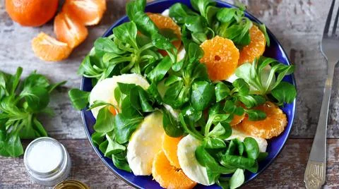 Healthy caprese salad with mandarin. Stock Photos