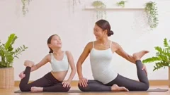 Mother and daughter doing yoga. woman and child training in the park.  outdoor sports. healthy sport lifestyle, chaturanga pose. well being,  mindfulness concept,watching video tutorial online on laptop 8497445 Stock  Photo at