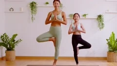 Mother and daughter doing yoga. woman and child training in the park.  outdoor sports. healthy sport lifestyle, chaturanga pose. well being,  mindfulness concept,watching video tutorial online on laptop 8497445 Stock  Photo at