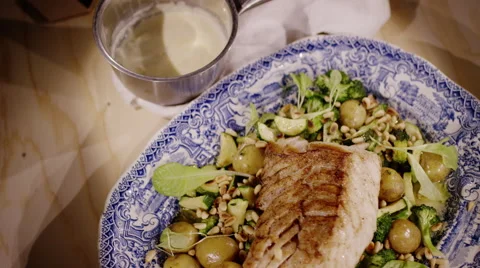 Healthy dish, grilled cod with vegetables and pine nuts Stock Footage 47049360