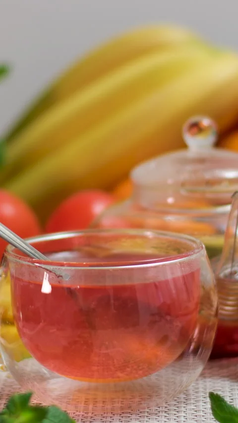 Healthy drinks on the table cherry pie berries fruits mint tangerines bananas Stock Footage 303499631