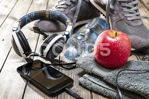 Healthy eating and equipment for leisure and outdoor sports, on rustic wooden Stock Photos