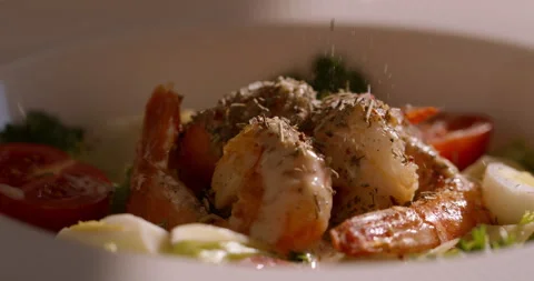 Healthy Eating in Focus: Mediterranean Shrimp Salad with Seasonings Added Stock Footage 294961753