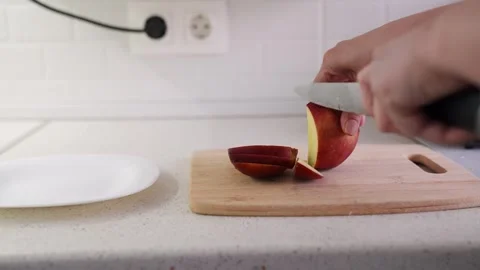 Healthy food prep process, Simple apple cutting scene, Kitchen counter fruit Stock Footage 315531066