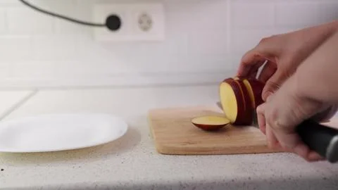 Healthy food prep process, Simple apple cutting scene, Kitchen counter fruit Stock Photos