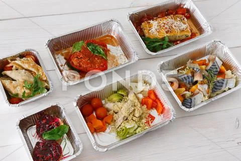 Healthy food take away in boxes on wood Stock Photos
