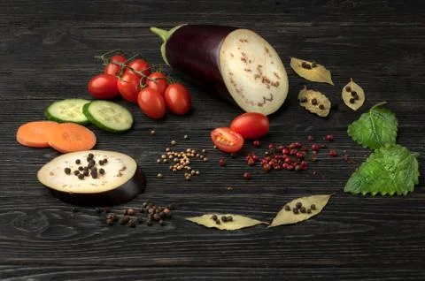 Healthy food. Vegetables on a dark wooden background. Top view. Copy space. Stock Photos