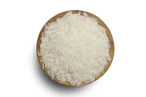 Healthy food. A wooden bowl of rice on a white background. Top view, high res Stock Photos