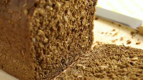 Healthy fresh baked dark multi grain bread close up Stock Footage 172143575
