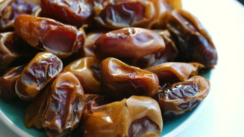 Healthy fresh dates rotating in a bowl Stock Footage 337893207