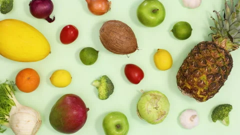 Healthy fresh pattern made of moving fruits and vegetables. Stop motion Stock Footage 154523127