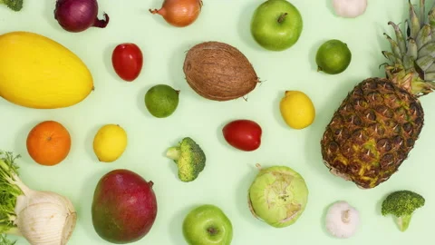 Healthy fresh pattern made of moving fruits and vegetables. Stop motion Stock Footage 154523226