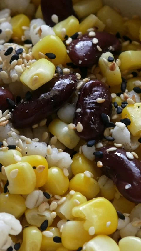 Healthy grain salad with sweet corn, beans, pearl barley and sesame Stock Footage 333292000