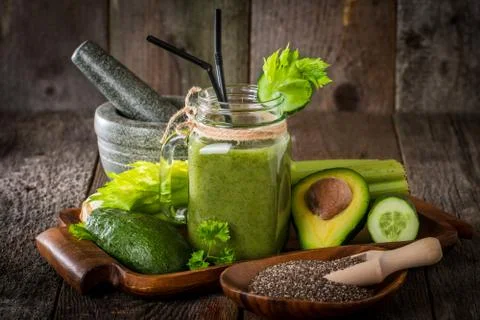 Healthy green juice smoothie with straw Stock Photos