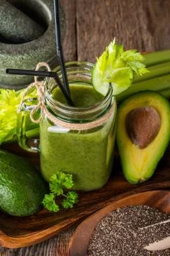 Healthy green juice smoothie with straw Stock Photos