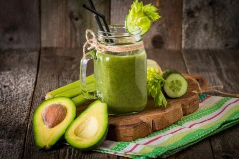 Healthy green juice smoothie with straw Stock Photos