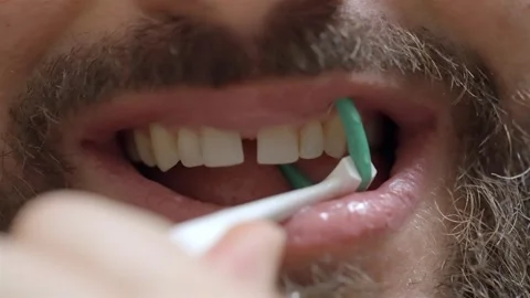 Healthy Gums Focus: Man Flossing Between Teeth with Floss Holder Stock Footage 306385288