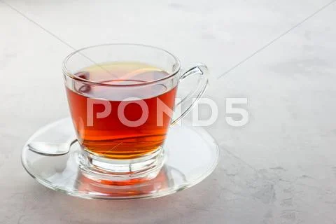 Healthy herbal rooibos red tea in glass cup, copy space Stock Photos
