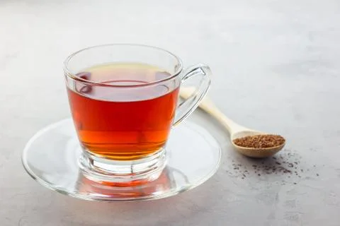 Healthy herbal rooibos red tea in glass cup, copy space 스톡 사진