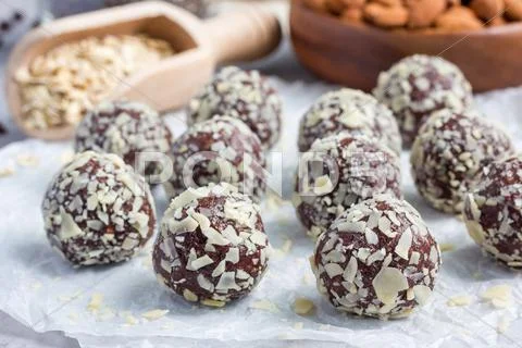Healthy homemade paleo chocolate energy balls on parchment, horizontal Stock Photos